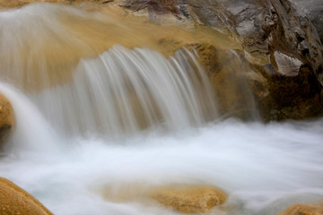 waterfall cascade in mountain brook