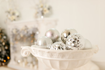 Obraz na płótnie Canvas christmas silver balls in a white pot