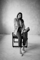 Obraz premium young bussineswoman sitting on a chair