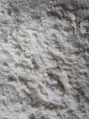 A layer of white flour on the table surface