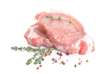 Raw pork meat with spices and herbs on white background