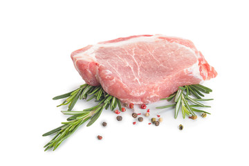 Raw pork meat with spices and herbs on white background