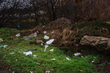 Disposable bags are scattered on the ground.