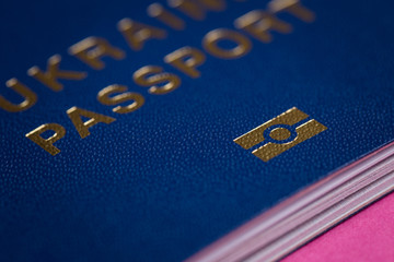 Blue biometric passport closeup. Biometrics sign shot on macro.