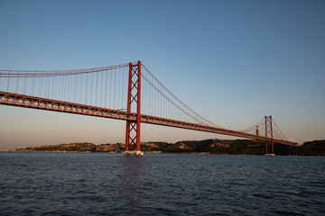 panorama of 25 april bridge at sunset