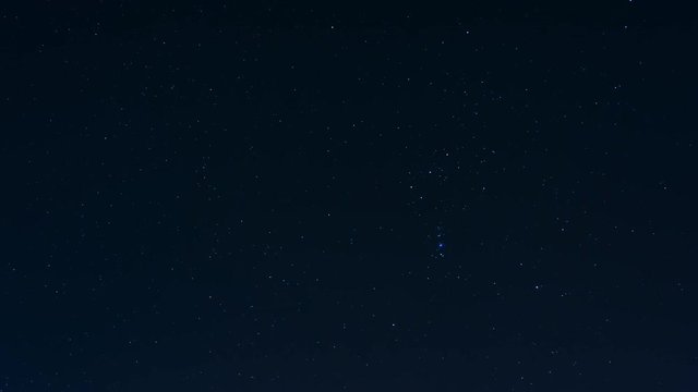 Stars moving across the night sky, timelapse. Orion constellation visible