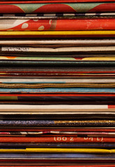 Pile of supermarket advertising brochures. Folded, stacked pages of discount flyers. paper wastage, signifying energy consumption, resources, environmental conservation concepts