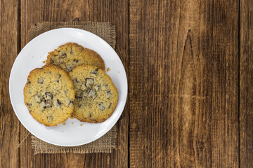 Portion of fresh Chocolate Chip Cookies (selective focus; close-up shot)