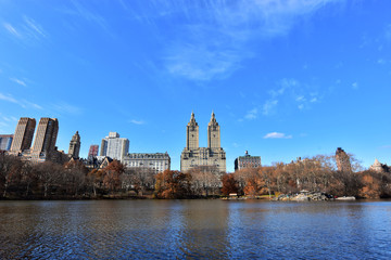 Fototapeta premium Manhattan buildings seen from inside of Central Park, one of the most visited tourist attractions worldwide in Manhattan, New York City.