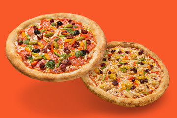 two juicy beautiful Italian pizzas, levitate, cast a shadow, the concept of Italian food, on a...