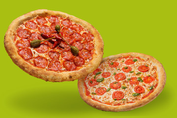 two italian pizzas with thick sides, levitate, cast a shadow, italian food concept, on green...