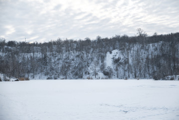 Winter park in the snow in the evening