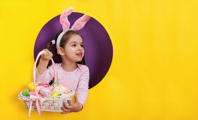 Happy girl with Easter  painted eggs