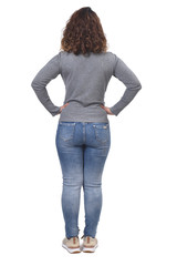 full portrait of a woman from behind on white, hands on hip