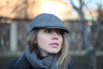 Closeup portrait of a beautiful girl in a cap