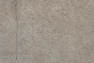 gray texture of concrete, plaster. crack on the surface. sand, cement. covering the building outside. rough surface finish
