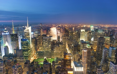 Naklejka na ściany i meble Night aerial view of Midtown Manhattan skyscrapers from a high viewpoint, New York City, USA