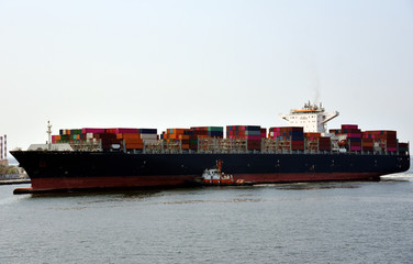 Cargo container ship arriving to the sea port in Kaohsiung, Taiwan.