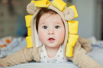 Cute baby boy in lion costume