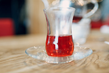 Red drink in a small glass