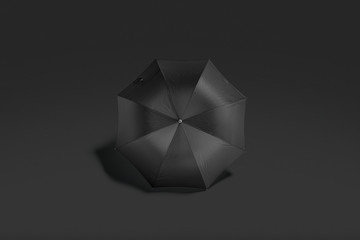 Blank black opened umbrella mockup lying on dark background