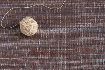 Thick thick thread for embroidery and needlework on a brown background.