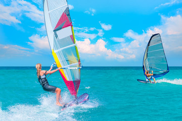 Beautiful cloudy sky with Windsurfer Surfing The Wind On Waves In Alacati - Cesme, Turkey