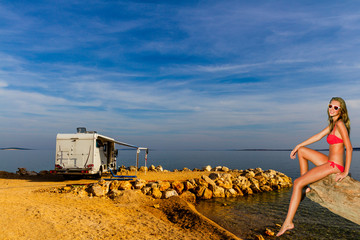 Europe travel attractive tourist girl in camping ground with camper, croatian summer vacation....