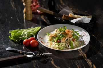 salad with shrimp squid tomatoes and a lot of greens, salad with seafood