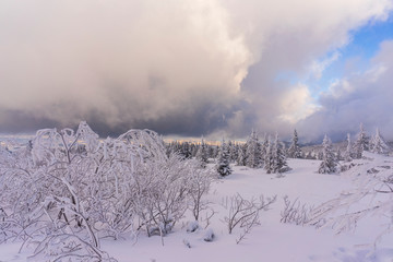 Clouds in the setting sunlight on mountain hills. Tatry.
