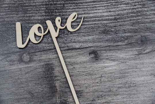  love topper decoration on wooden background