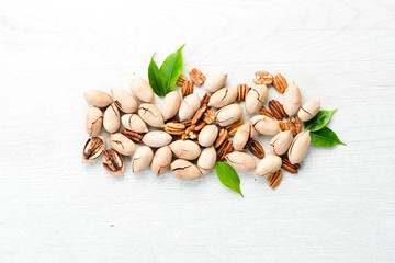 Delicious Pecan nuts on white background Wooden. Top view. Free space for your text.