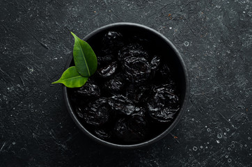 Prunes. Dried plums. Top view. Free space for your text.