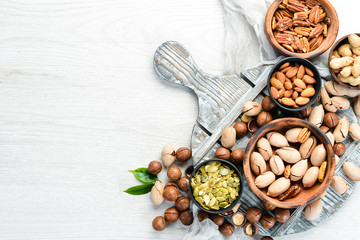 Set of nuts. Macadamia nuts, pecans, peanuts and almonds. Top view.