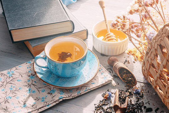 Tea In A Blue Porcelain Cup On A Table In The Sun