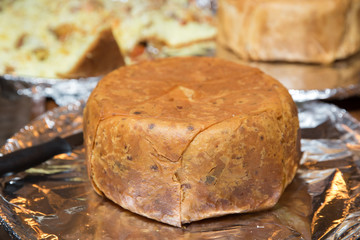 Khan pilaf in a pita. Traditional oriental dish on tableware Azerbaijan with fire on a table in restaurant .the chef cuts off the drill. Shah pilaf.