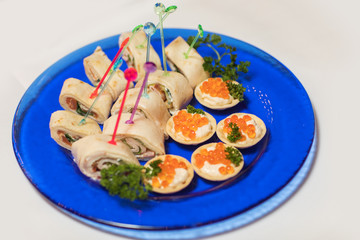 Canape with red caviar for party, selective focus