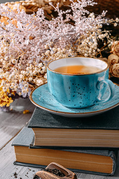 Tea And A Book In The Spring Sunshine. Near Honey And Flowers