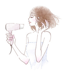 ドライヤーでボブヘアを乾かす若い女性