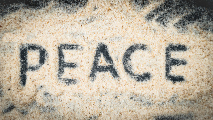 Top view of PEACE text written