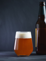 Craft beer IPA in a glass on a dark background