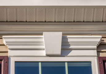 White soffit providing optimal ventilation for roof overhangs. Double pane window framed with a...