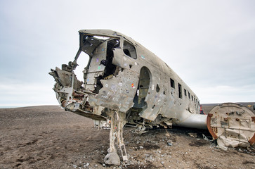 SOLHEIMASANDUR, ICELAND - AUGUST 3RD, 2019: Wreckage of Crashed Airplane on the Coast of Iceland Black Sand Beach