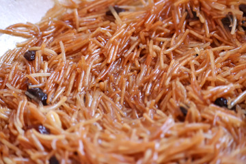 Coconut Sevai, a noodle dish from India,bowl in savaiya / khir ,beautiful nuts mix  sevai
