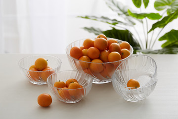 Glass fruit tray with little kumquat