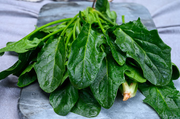 Young fresh leaves of green organic spinach ready to cook