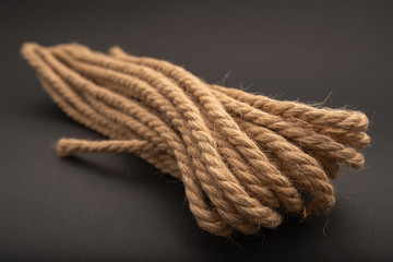 brown thick rope, rope on black background