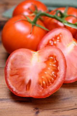 Red ripe tasty Dutch tomatoes growing indoor in greenhouse all seasons, food industry in Netherlands