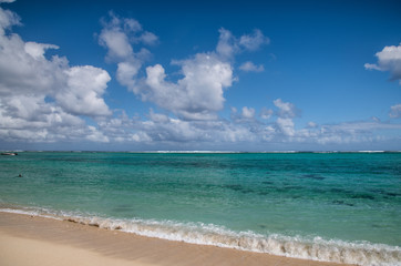 Le Morne public beach in Mauritius. Palms and crystal clear water on a beautiful sunny day