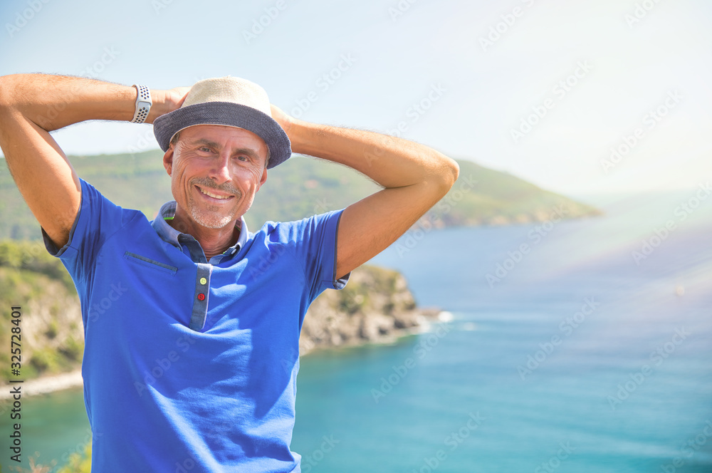 Sticker Man wearing straw hat relaxing at the sea, ocean in background